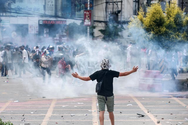 <p>Demonstrators clash with riot police personnel during a protest outside the Parliament in Kathmandu on 8 September 2025</p>
