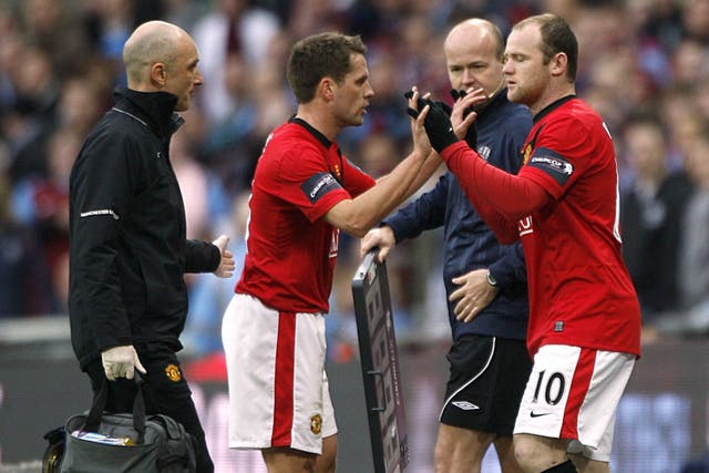 Wayne Rooney (right) has given a diplomatic response to claims from Michael Owen he was the better teenaged footballer (Nick Potts/PA)