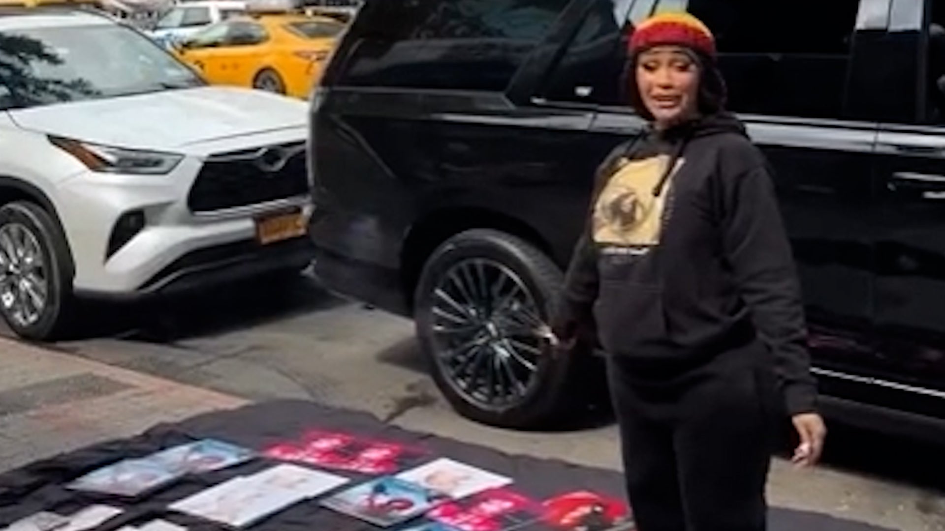 <p>Cardi B pokes fun at trial as she poses as bootleg album seller on New York street</p>