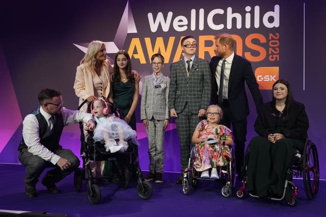 The Duke of Sussex poses with current and previous award recipients (Aaron Chown/PA)