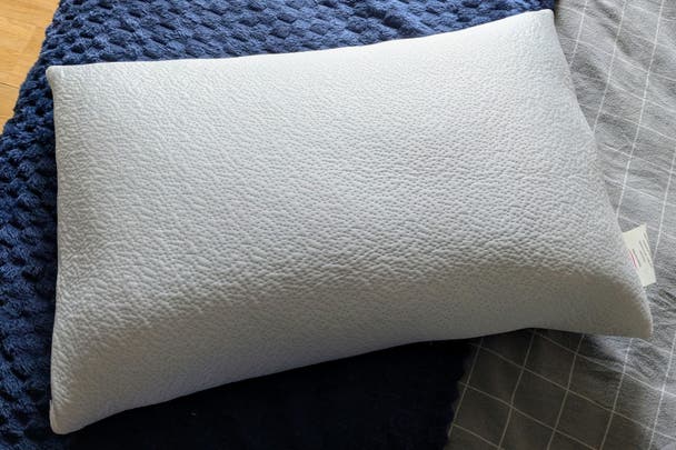 Original testing imagery of the Dreams TheraPur Memory Foam Ice Pillow on a bed