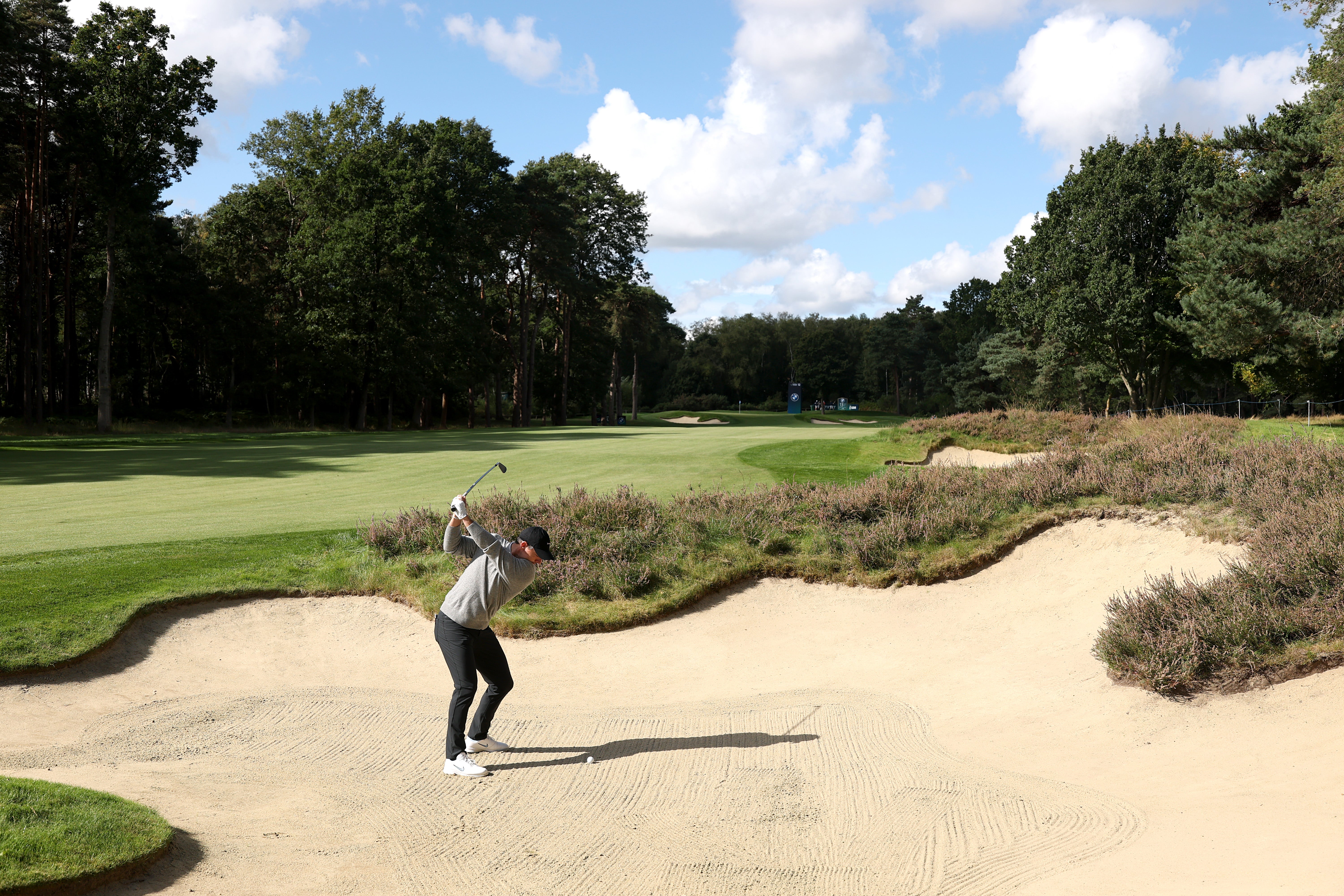 McIlroy plays from a bunker during a practice round at Wentworth