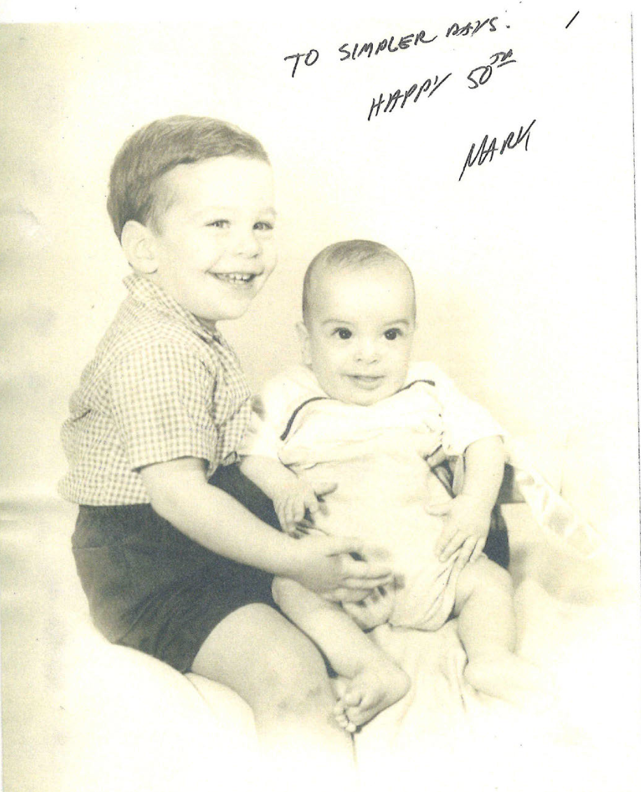A picture of two young boys who appear to be Jeffrey Epstein and his younger brother, Mark. The picture is signed: 'To simpler days. Happy 50th. Mark'