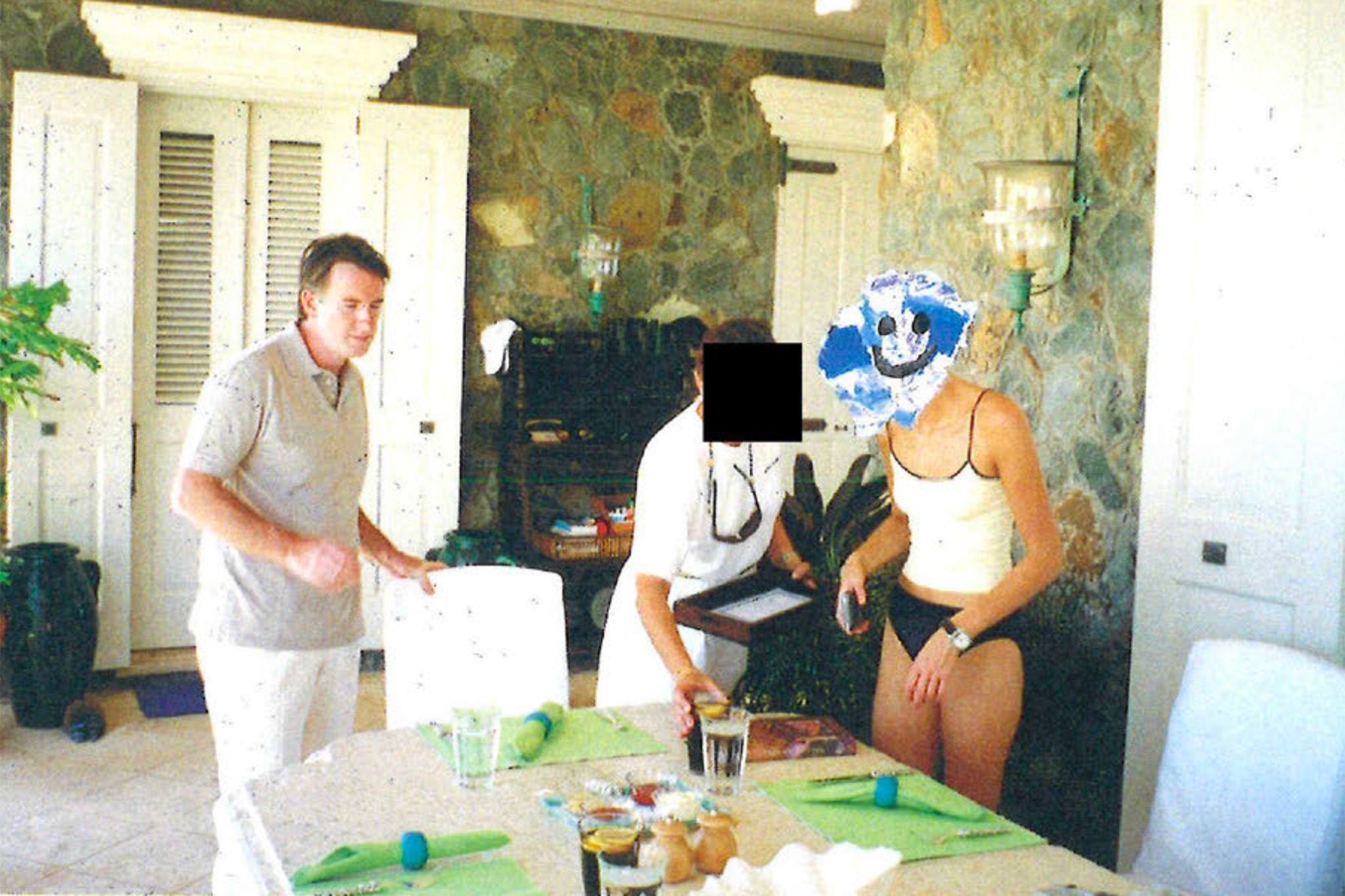 Peter Mandelson and unidentified people in a photograph included in Mandelson’s birthday message to the billionaire financier Jeffrey Epstein, alongside text reading ‘leaving you with some “interesting friends” to entertain instead’