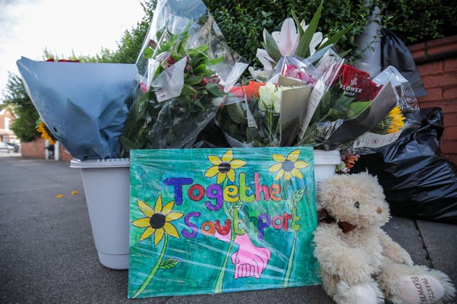 Floral tributes on the junction of Tithebarn Road and Hart Street in Southport, near the scene where three children were fatally stabbed (James Speakman/PA)