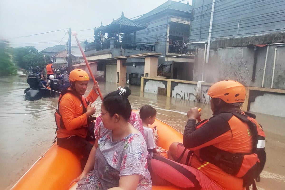 Flash floods in Indonesia leave at least 11 dead and 13 missing