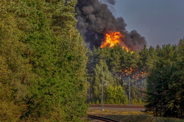 <p>Smoke and flames rise following powerful explosions after several rail cars loaded with liquefied gas caught fire in the suburbs of Vilnius, Lithuania, Wednesday, Sept. 10, 2025. (AP Photo/Mindaugas Kulbis)</p>