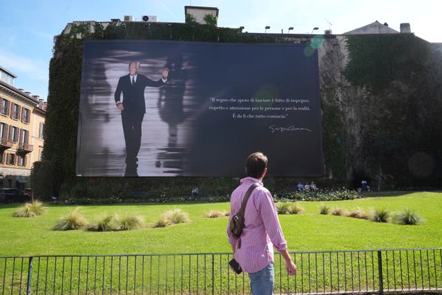 <p>A giant memorial poster for designer Giorgio Armani, who died on Thursday at age 91, is set up in Milan, northern Italy, Sunday, Sept. 7, 2025. (AP Photo/Antonio Calanni)</p>