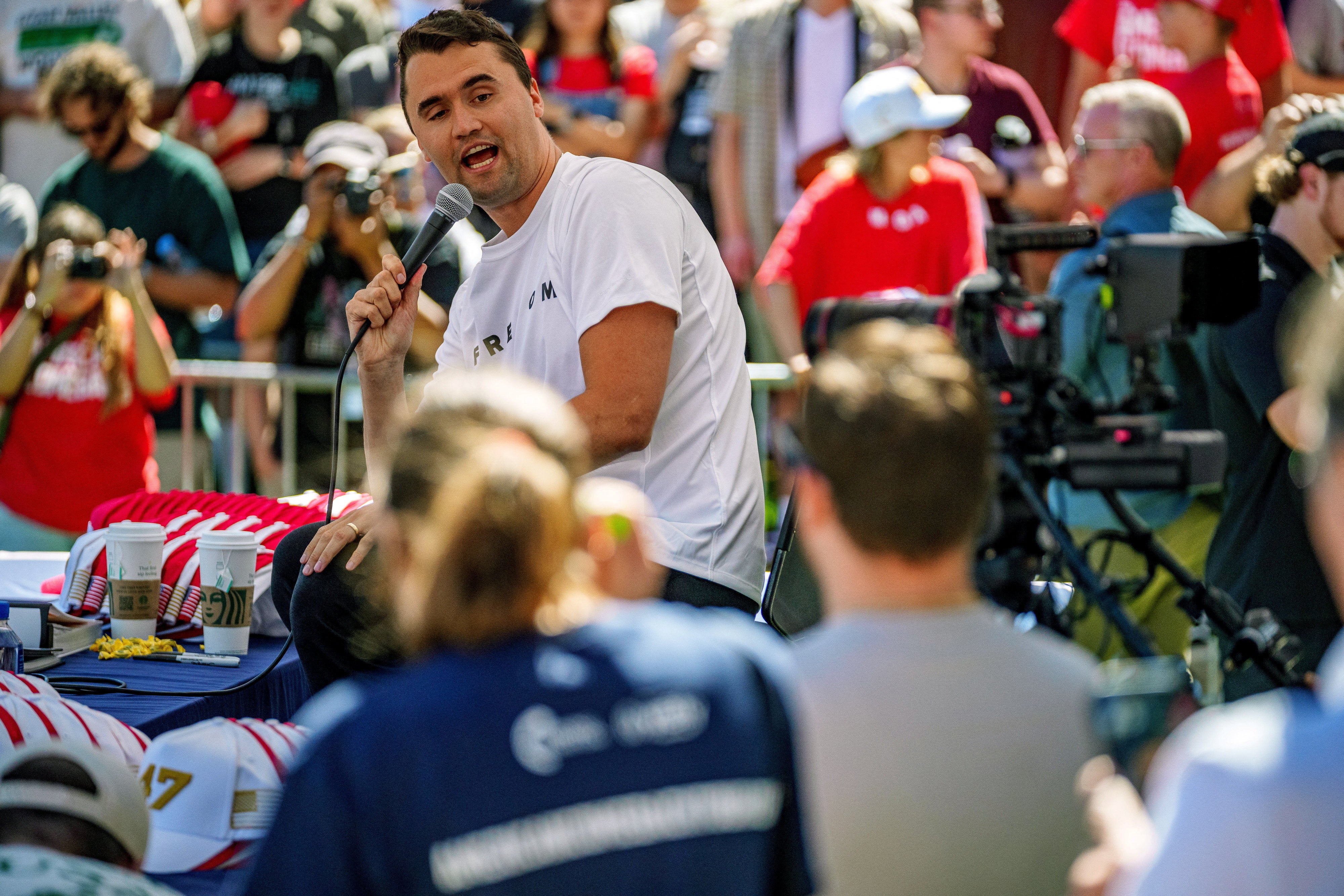 The MAGA broadcaster and political activist was sitting onstage in front of the student audience when he was shot