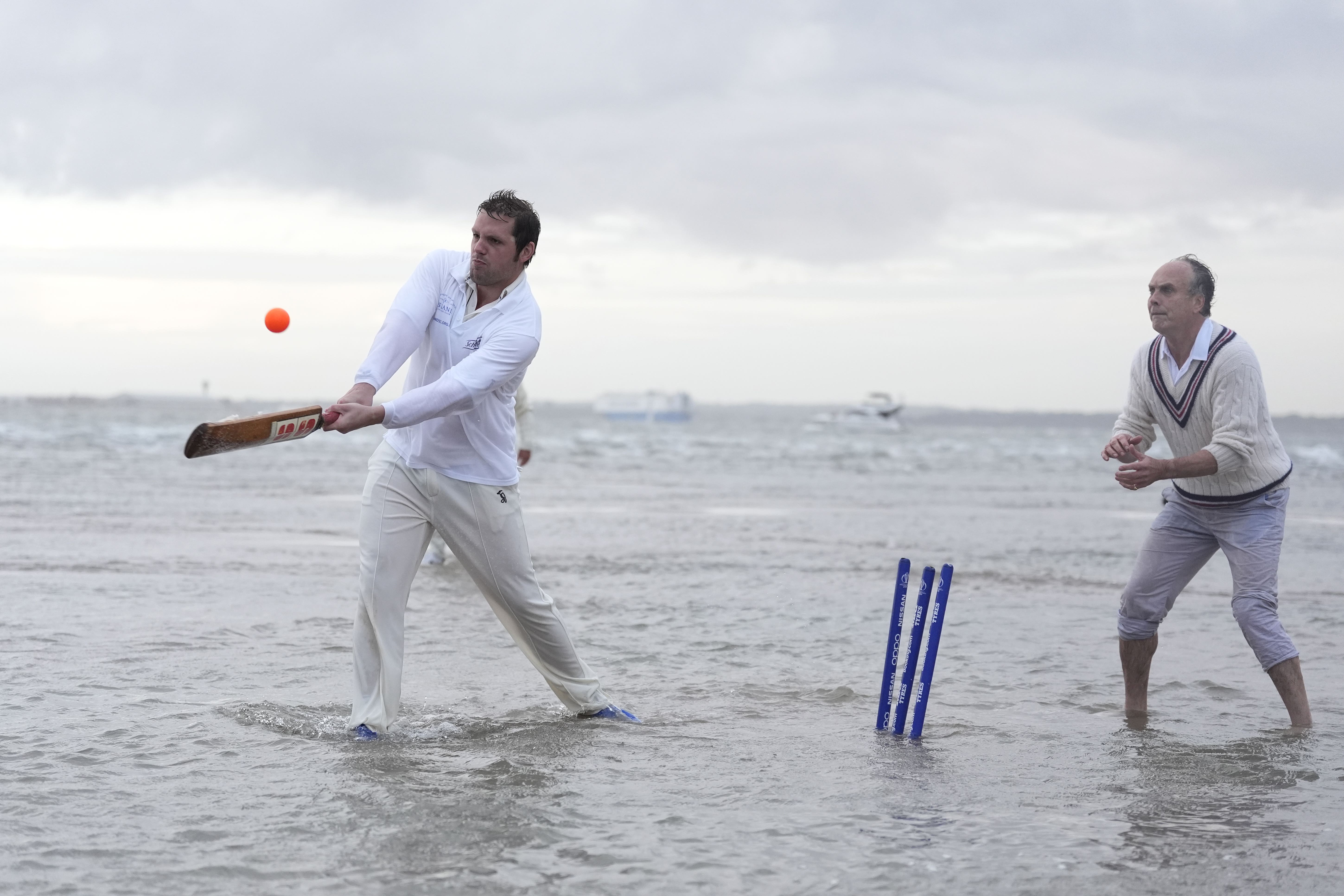 Members of the Royal Southern Yacht Club and the Island Sailing Club take part in the annual Brambles cricket match in the middle of the Solent at low tide (Andrew Matthews/PA)
