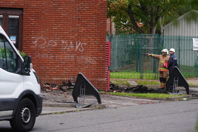 Graffiti on a wall as emergency services look the scene at the MP for Washington and Gateshead South Sharon Hodgson’s office (Owen Humphreys/PA)