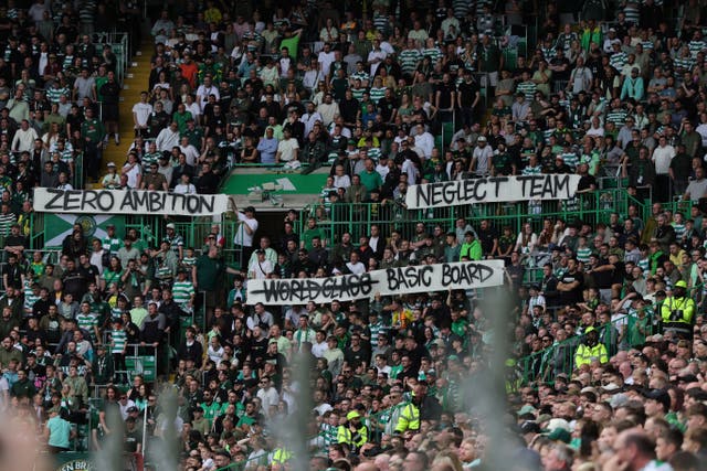 Celtic fans hold up protest banners in the Parkhead stands (Steve Welsh/PA)