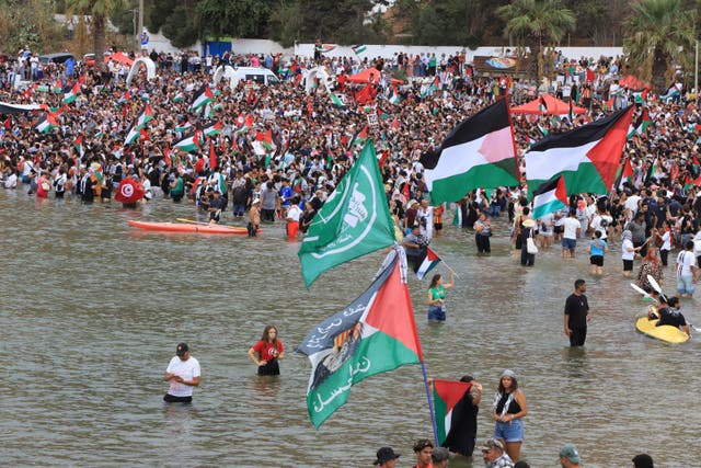 <p>People gather to show support for the Global Sumud Flotilla ahead of its scheduled departure to deliver aid to Gaza amidst Israel's blockade on the Palestinian territory, in Sidi Bou Said port in Tunis, Tunisia</p>