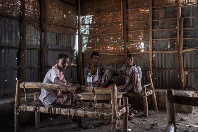 <p>Three men rest in the shade of a makeshift coffee place in Guyah, in the Danakil Depression in Ethiopia's Afar region. In the heart of the Horn of Africa, the Danakil Depression is one of the hottest, most inhospitable place on earth, with temperatures topping 50 degrees Celsius
</p>