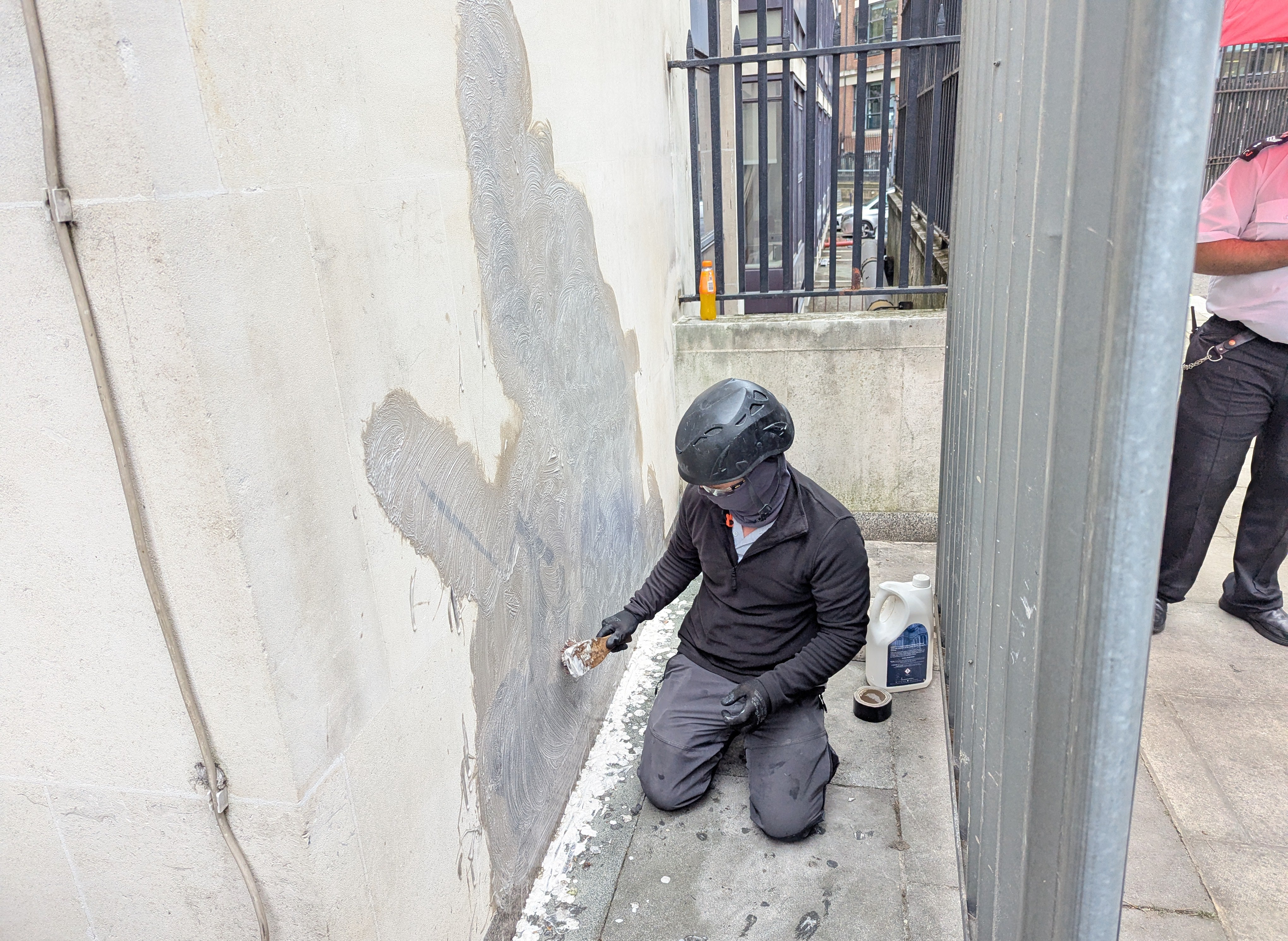 The new artwork by Banksy at the Royal Courts of Justice being removed on Wednesday