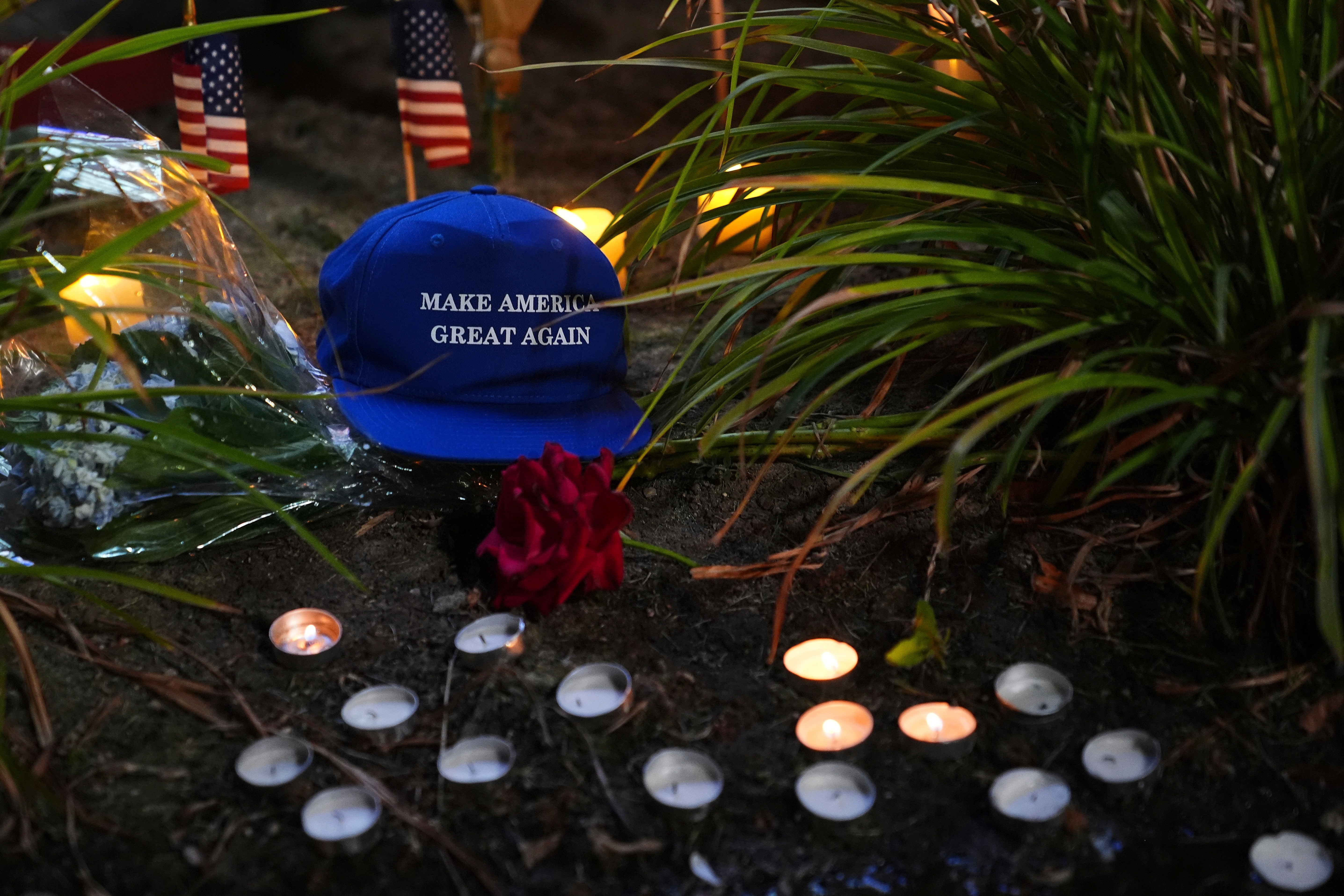 Make America Great Again hat is placed at a growing vigil outside Timpanogos Regional Hospital in Orem, near where Charlie Kirk was shot and killed Wednesday