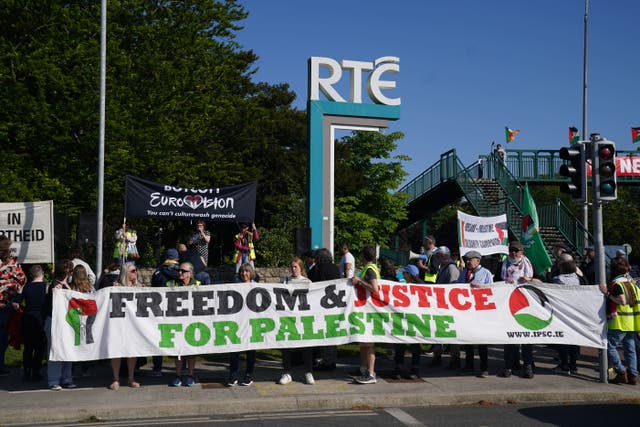 <p>People attend a pro-Palestine protest outside RTE in Dublin (Brian Lawless/PA)</p>