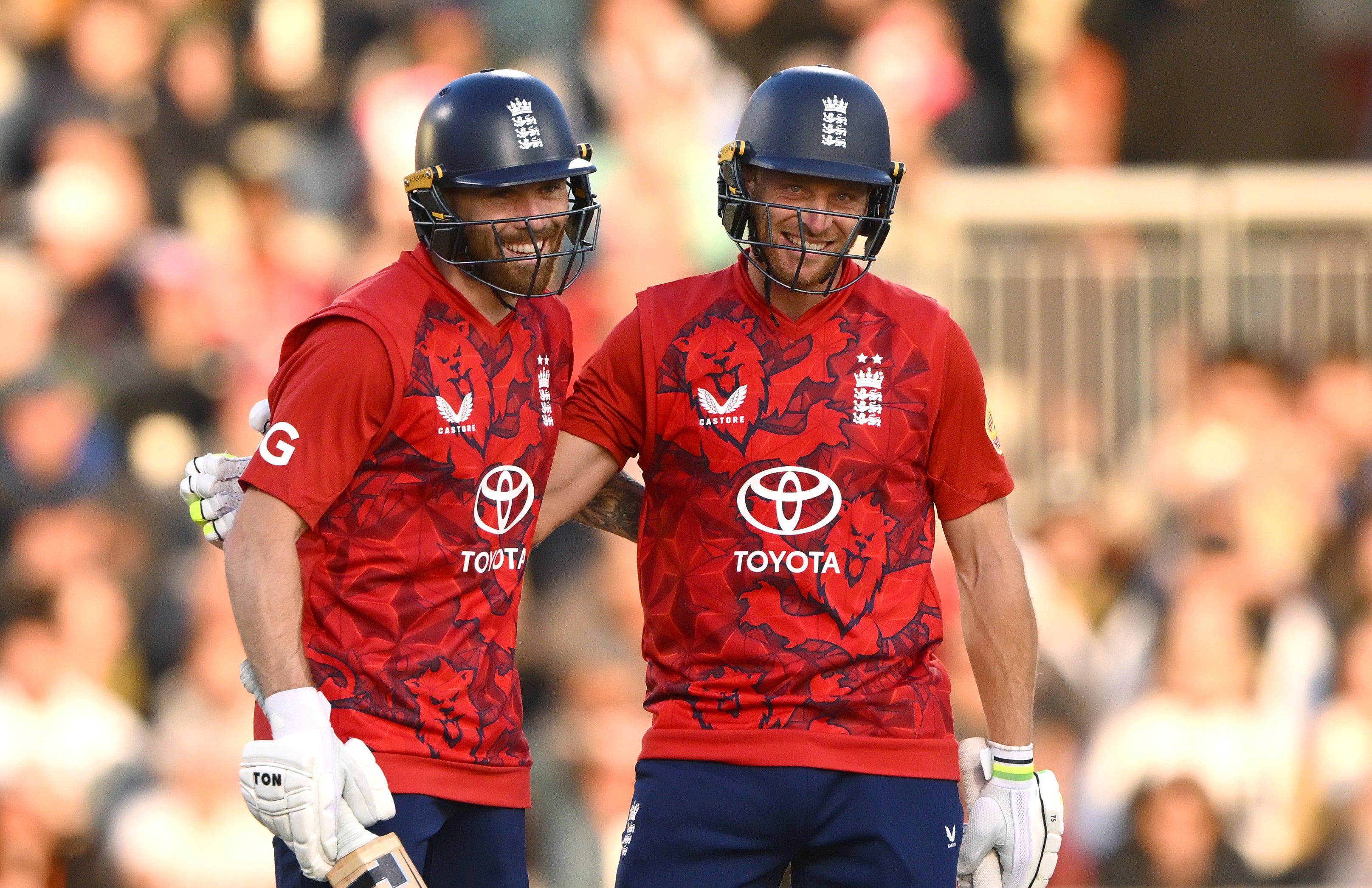 Phil Salt and Jos Buttler celebrate their century partnership