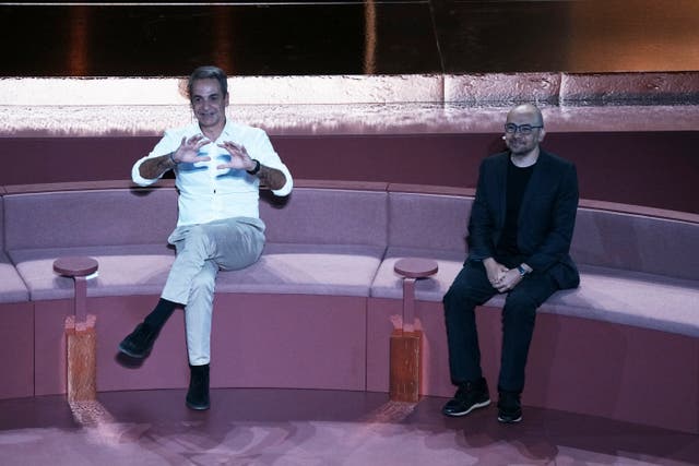 <p>Greece's Prime Minister Kyriakos Mitsotakis, left, and Demis Hassabis, CEO of Google's artificial intelligence research company DeepMind discuss the future of AI, ethics and democracy during an event at the Odeon of Herodes Atticus, in Athens, Greece, Friday, Sept. 12, 2025. (AP Photo/Thanassis Stavrakis)</p>