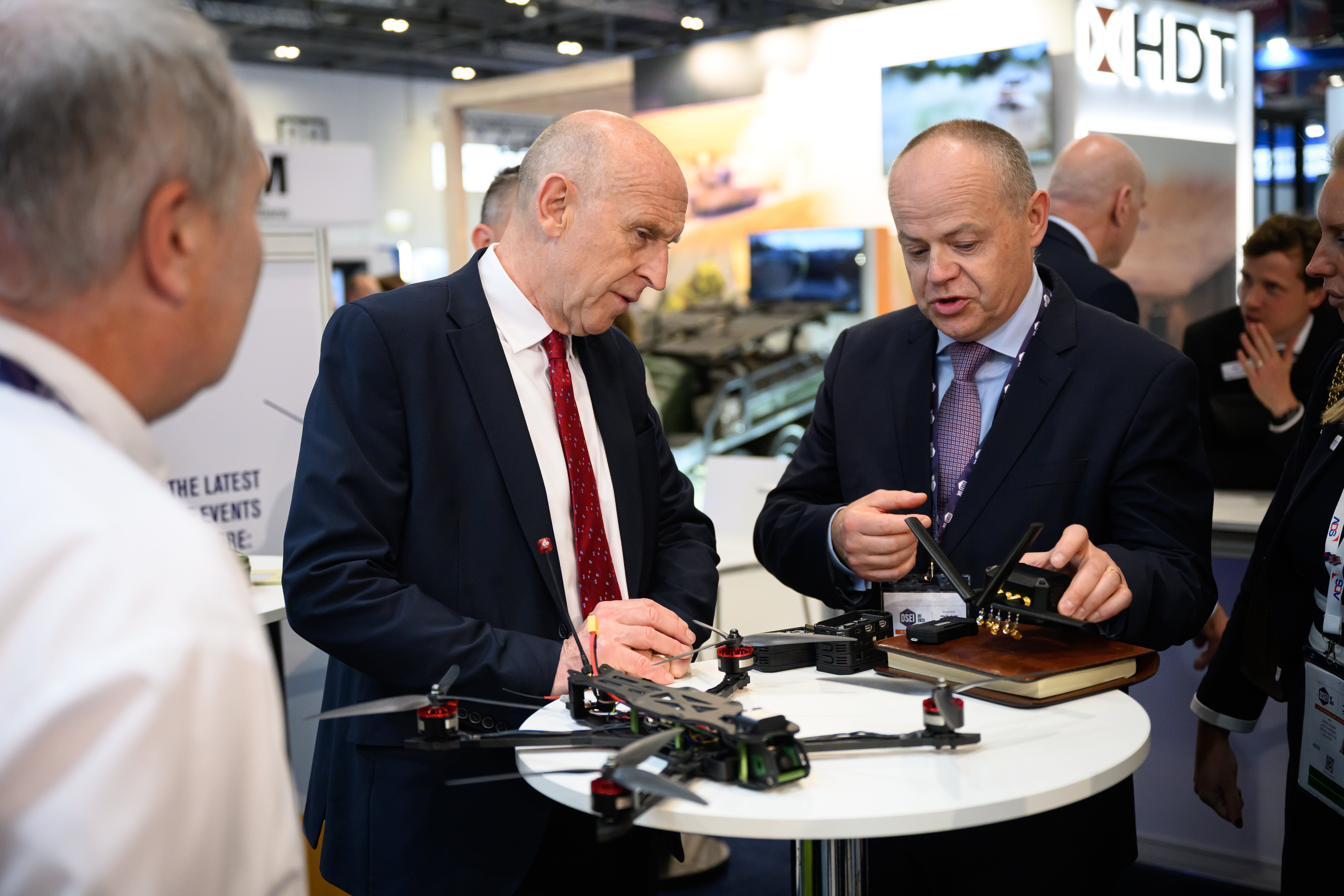 Defence secretary John Healey (centre) looks at a piece of drone technology on the third day of the Defence and Security Equipment International (DSEI) exhibition in London on 11 September