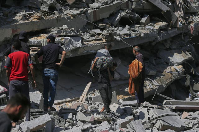 <p>Palestinians inspect the rubble of a building after an Israeli military strike in Gaza City, Friday, Sept. 12, 2025. (AP Photo/Yousef Al Zanoun)</p>