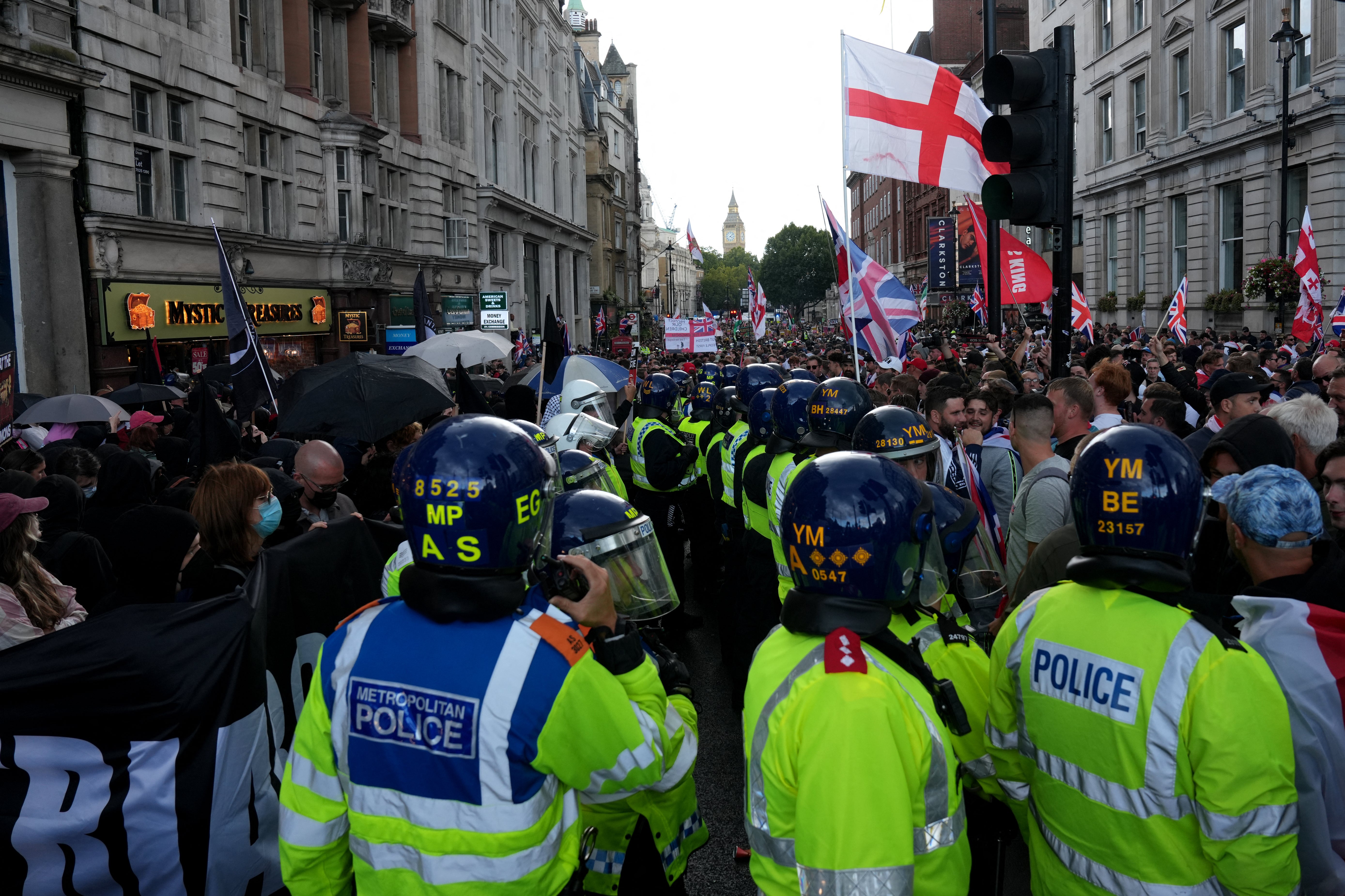 Police officers divide Anti-Fascist protesters and supporters of British far-right figure Tommy Robinson