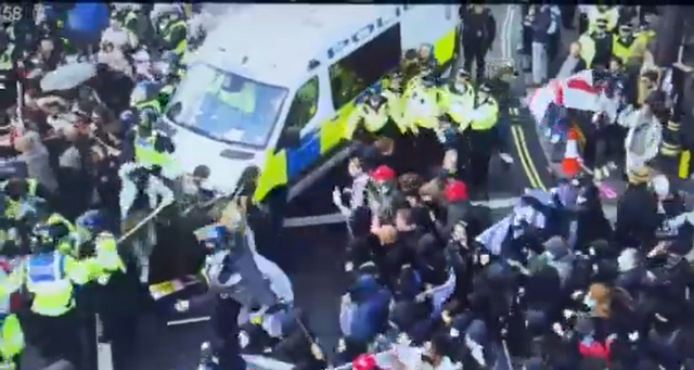 Dozens of police officers injured and 24 arrests as huge Tommy Robinson ...