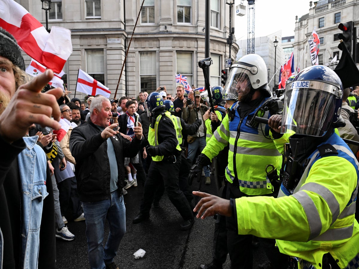 Dozens of police officers injured and 24 arrests as huge Tommy Robinson rally marred by violence | The Independent