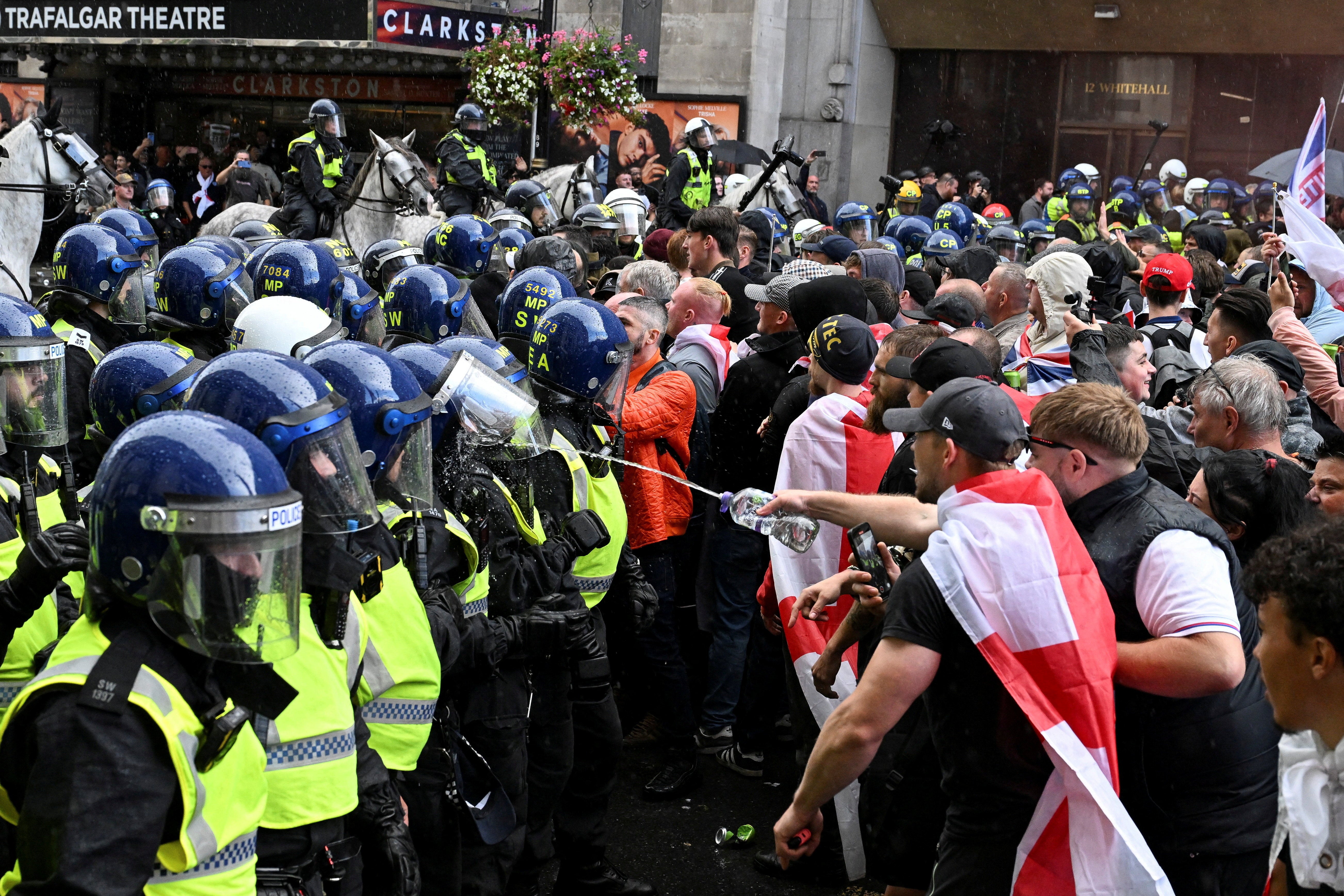 Police clashed with anti-migrant protesters at a march organised by Tommy Robinson on Saturday