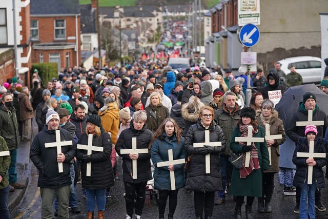 People take part in a march to mark the 50th anniversary of Bloody Sunday in Derry. Picture date: Sunday January 30, 2022.
