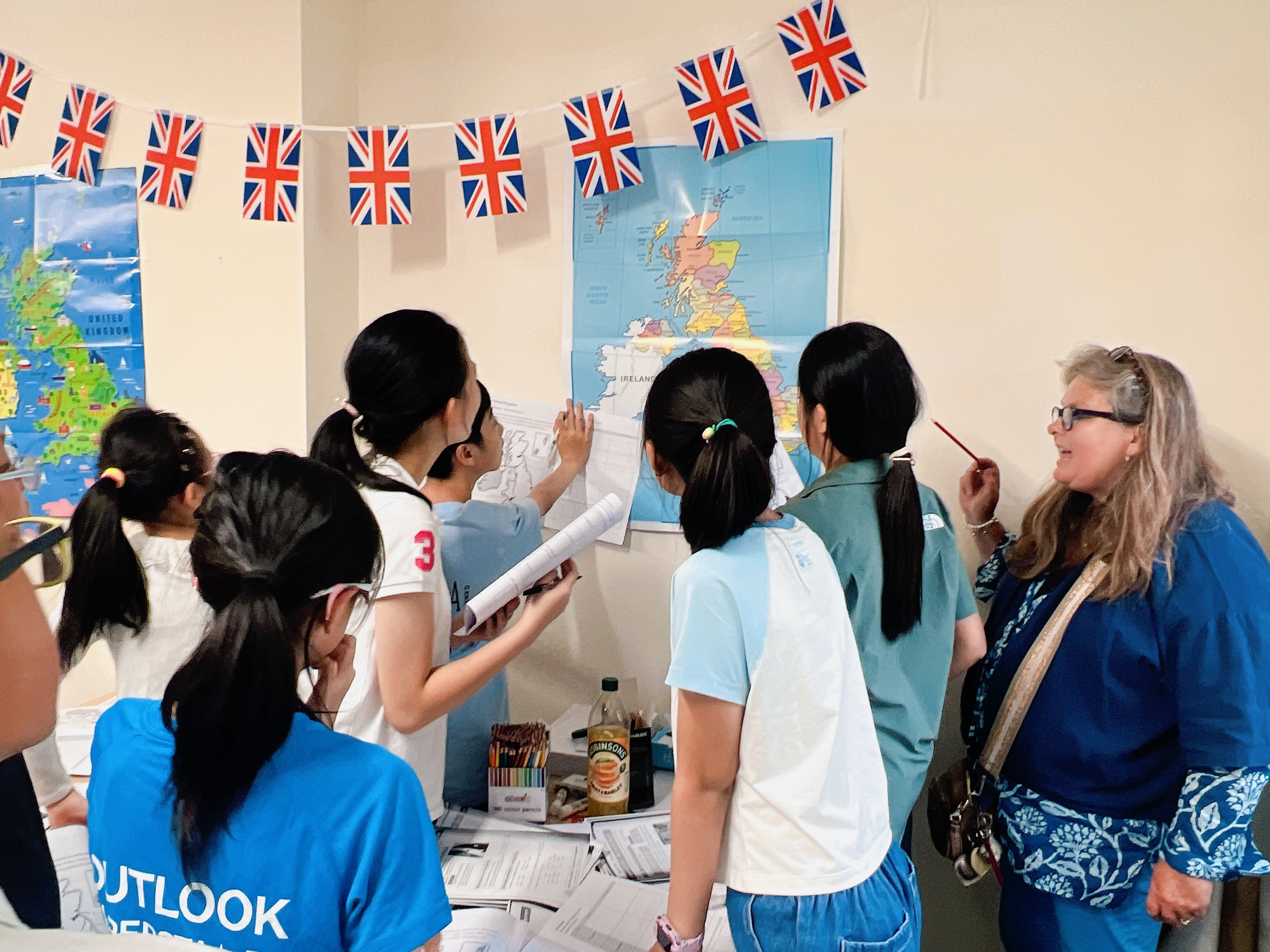 Chinese students take part in a geography workshop during a UK summer programme and learn about the country with guidance from a local teacher