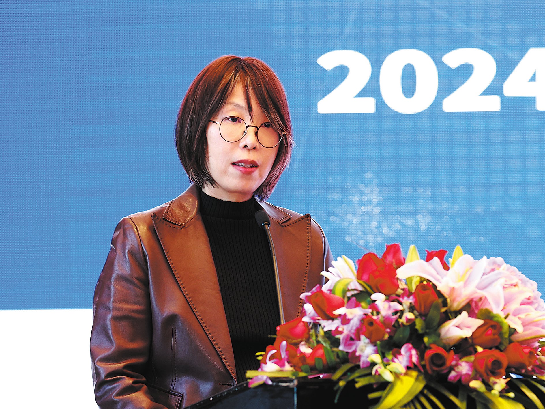 Li Wen, chief of mission in China for the International Organisation for Migration, speaks at a workshop for the 2024 International Migrants Day on 17 December