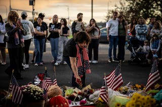 Mourners leave flowers at the UVU campus Saturday