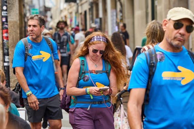 <p>Pilgrims walk in Santiago de Compostela downtown, northwestern Spain, Thursday, Aug. 21, 2025. (AP Photo/Lalo Villar)</p>