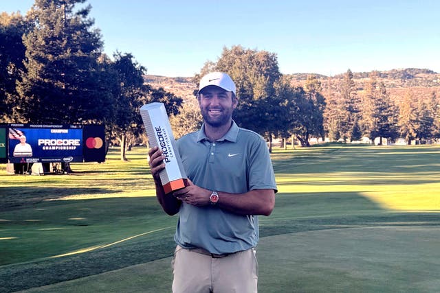 Scottie Scheffler holds the trophy after winning the Procore Championship in Napa, California (Doug Ferguson/AP)