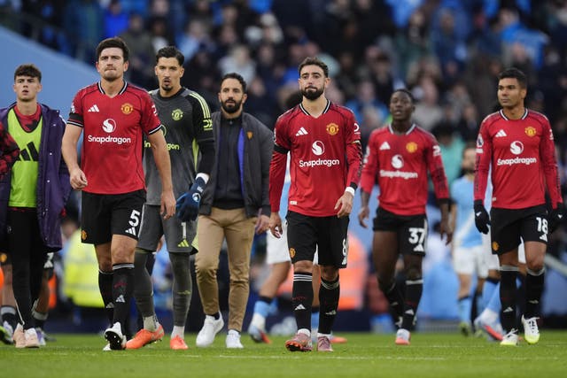 Bruno Fernandes, centre right, and Manchester United tasted derby defeat (Nick Potts/PA)
