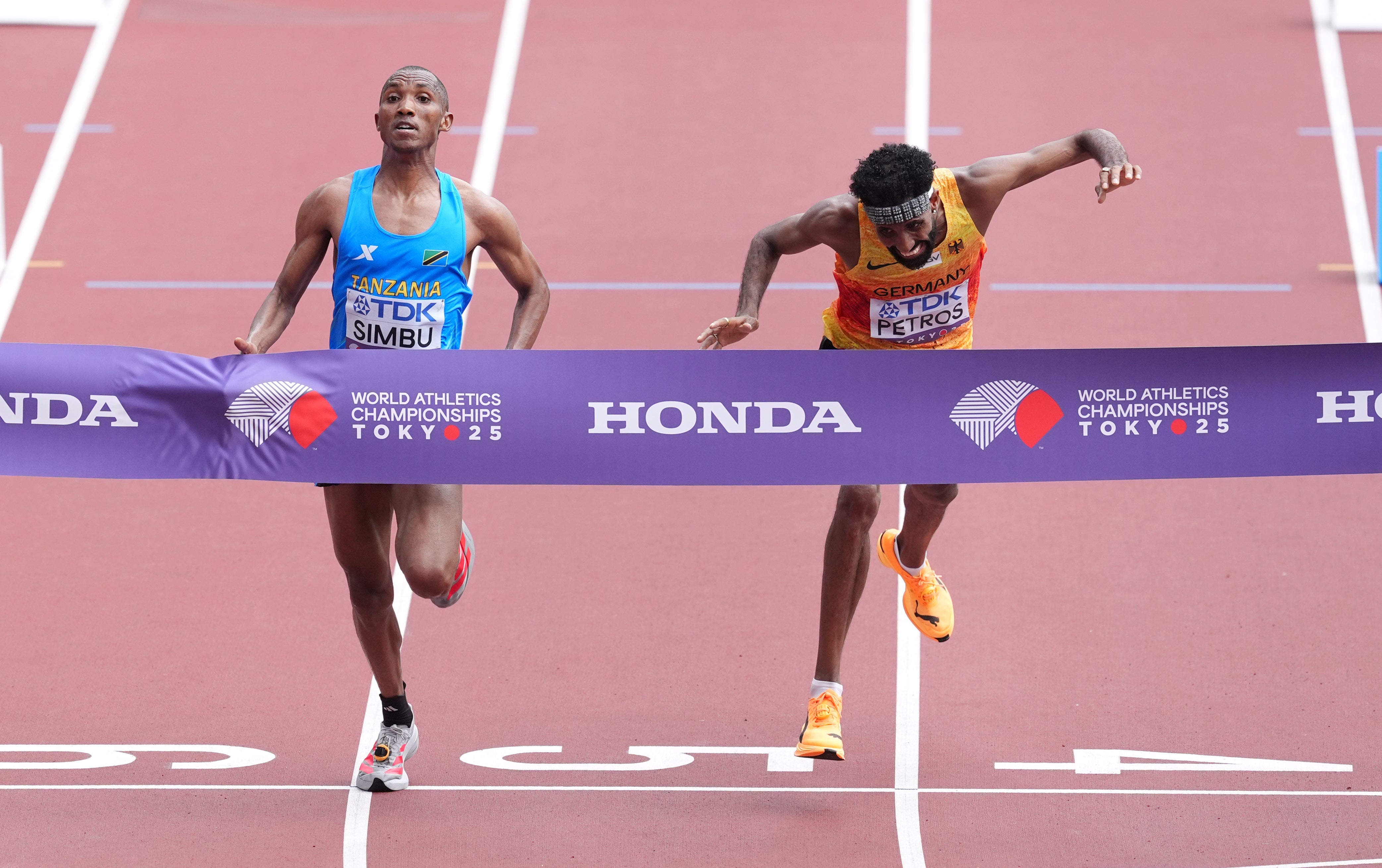 Tanzania's Alphonce Felix Simbu beats Germany's Amanal Petros in a thrilling photo finish to the men’s marathon