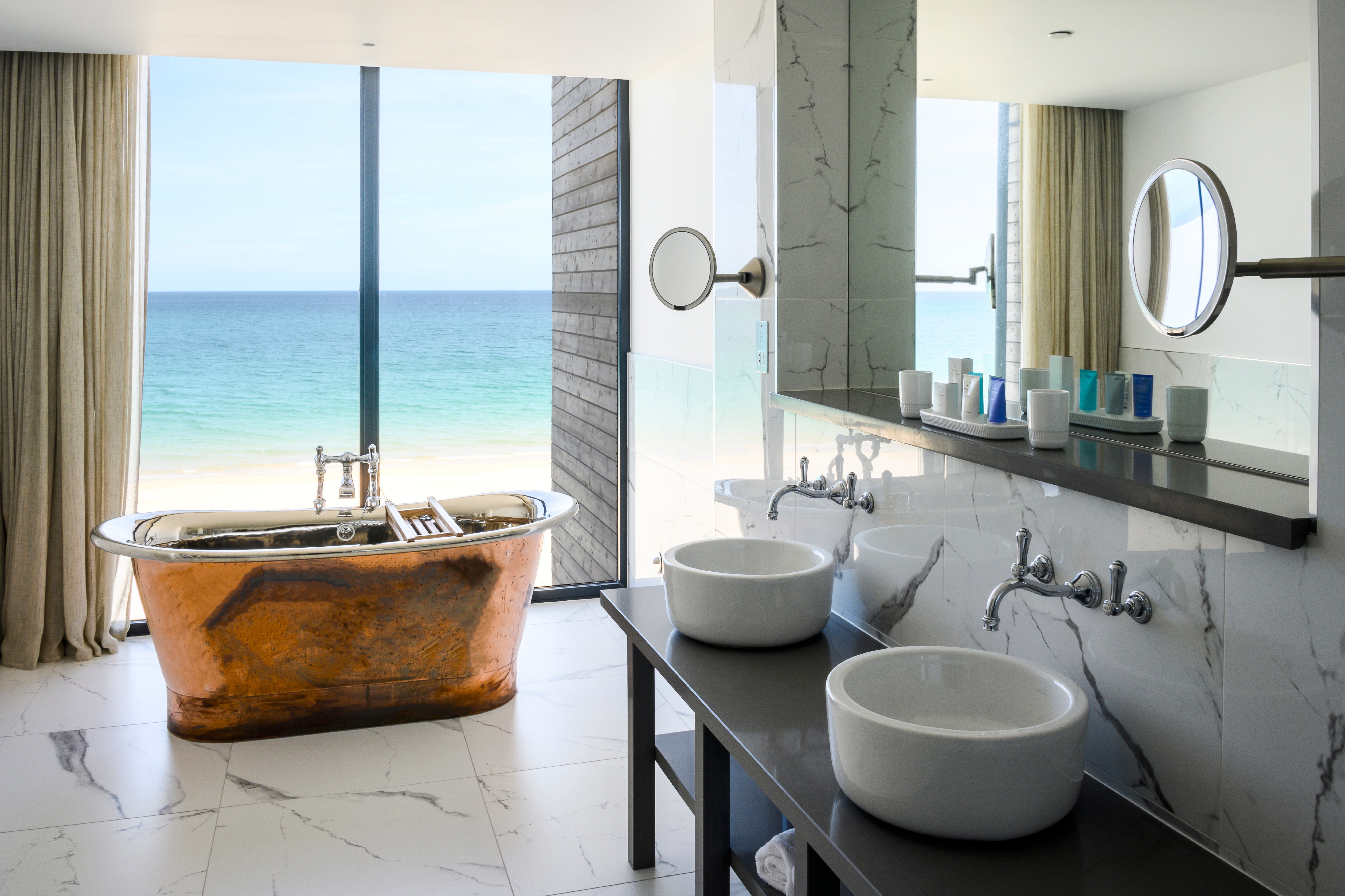 Carbis Bay beach lodge bathrooms boast first-class ocean views