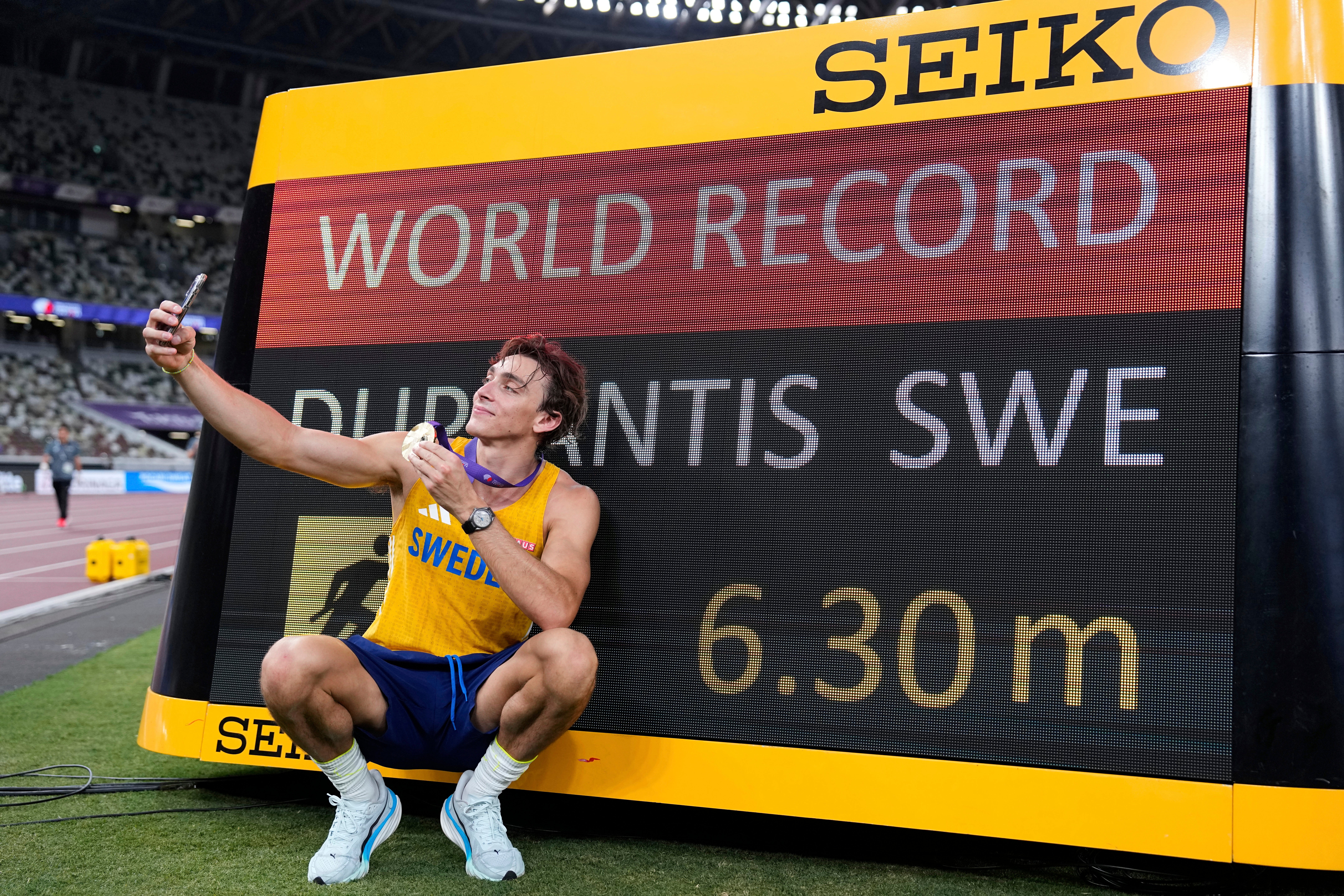 Sweden's Armand Duplantis takes a selfie after setting a new men's pole vault world record