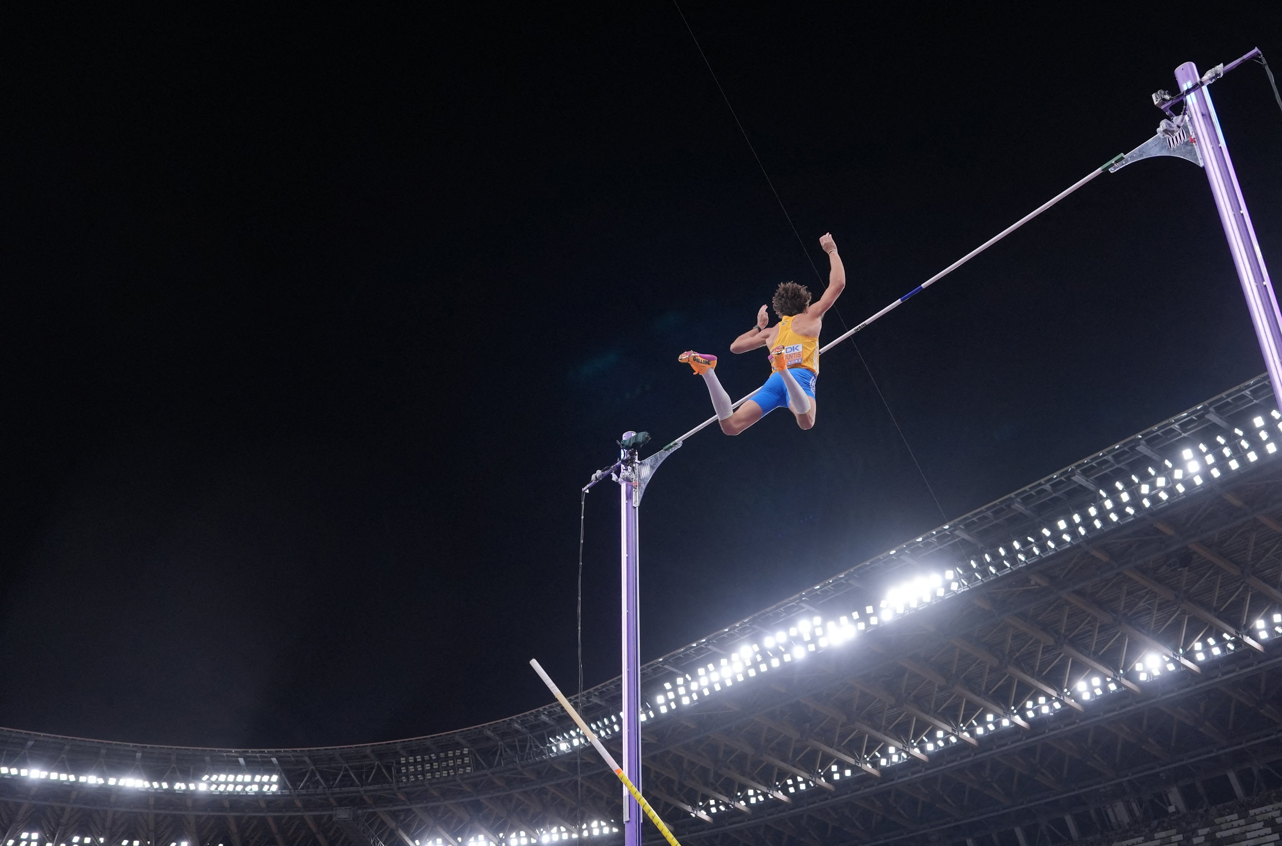 Sweden's Armand Duplantis clears the bar to win gold and break the world record
