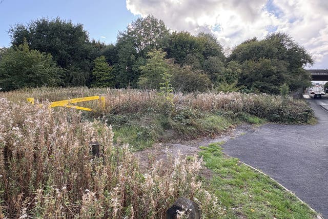 A previously sealed-off area of grassland near Tame Road in Oldbury (Matthew Cooper/PA)