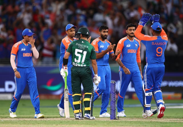 <p>Jasprit Bumrah of India celebrates with teammates after dismissing Mohammad Haris of Pakistan during an Asia Cup match in Dubai on 14 September 2025</p>