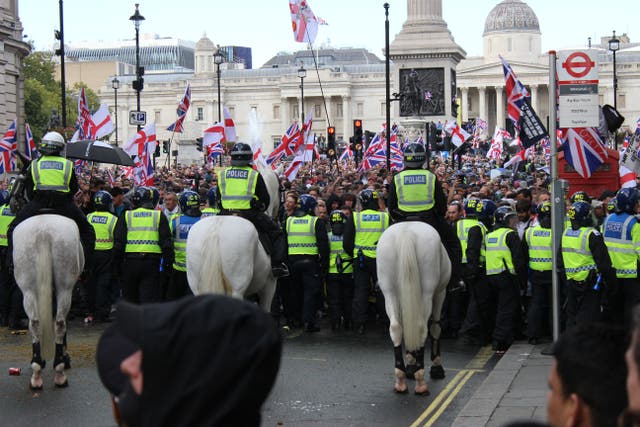 Police push back protesters taking part in the Tommy Robinson-led Unite the Kingdom march and rally (Pol Allingham/PA)