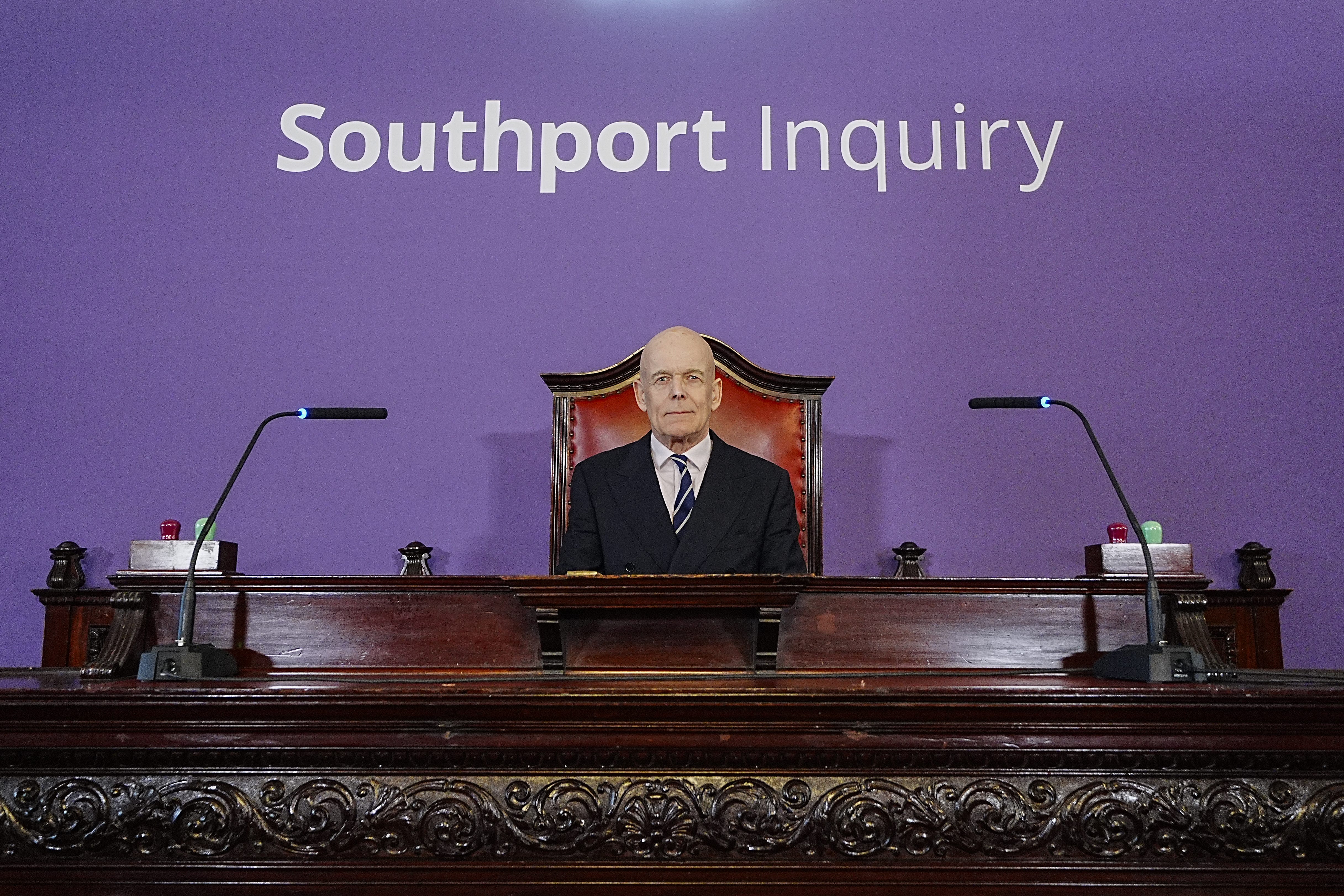 Sir Adrian Fulford sitting inside the hearing room at Liverpool Town Hall (Peter Byrne/PA)