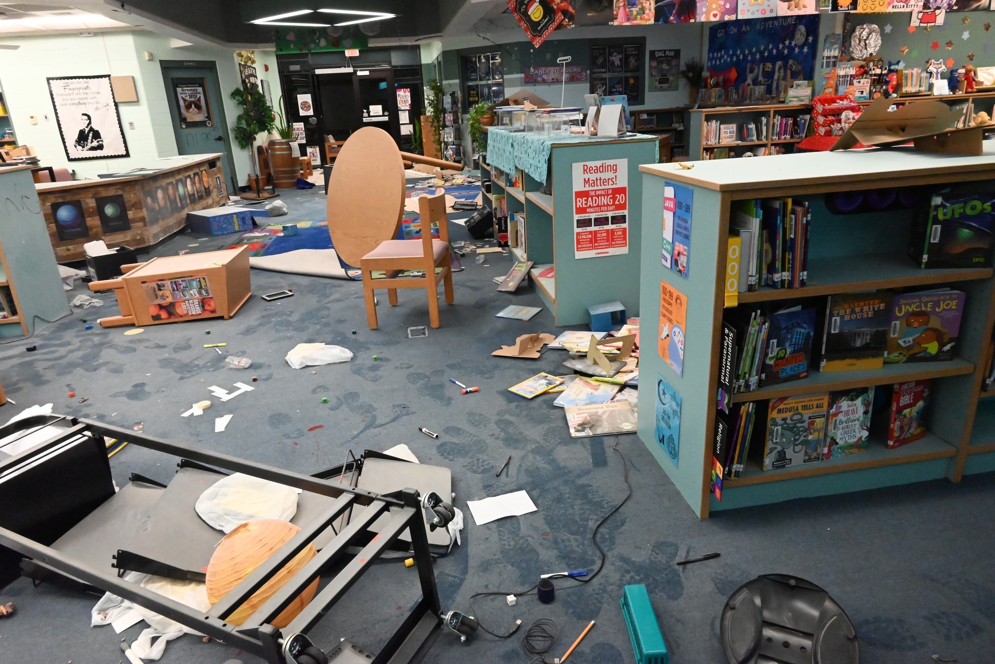 Body camera footage showed extensive damage to the library and media center. Books and furniture were strewn all over the room as officers and a K9 unit examined the property
