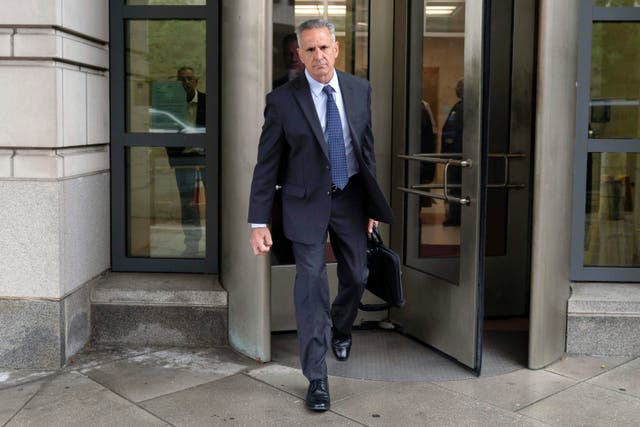 <p>Retired Adm. Robert P. Burke, 63, walks out of the federal courthouse after being sentenced to six year in prison for his conviction on corruption charges, Tuesday, Sept. 16, 2025, in Washington. (AP Photo/Jose Luis Magana)</p>