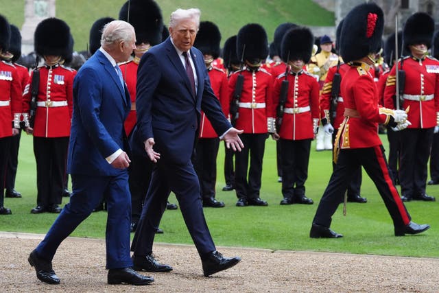 <p>The King and Donald Trump review the guard of honour during the ceremonial welcome</p>