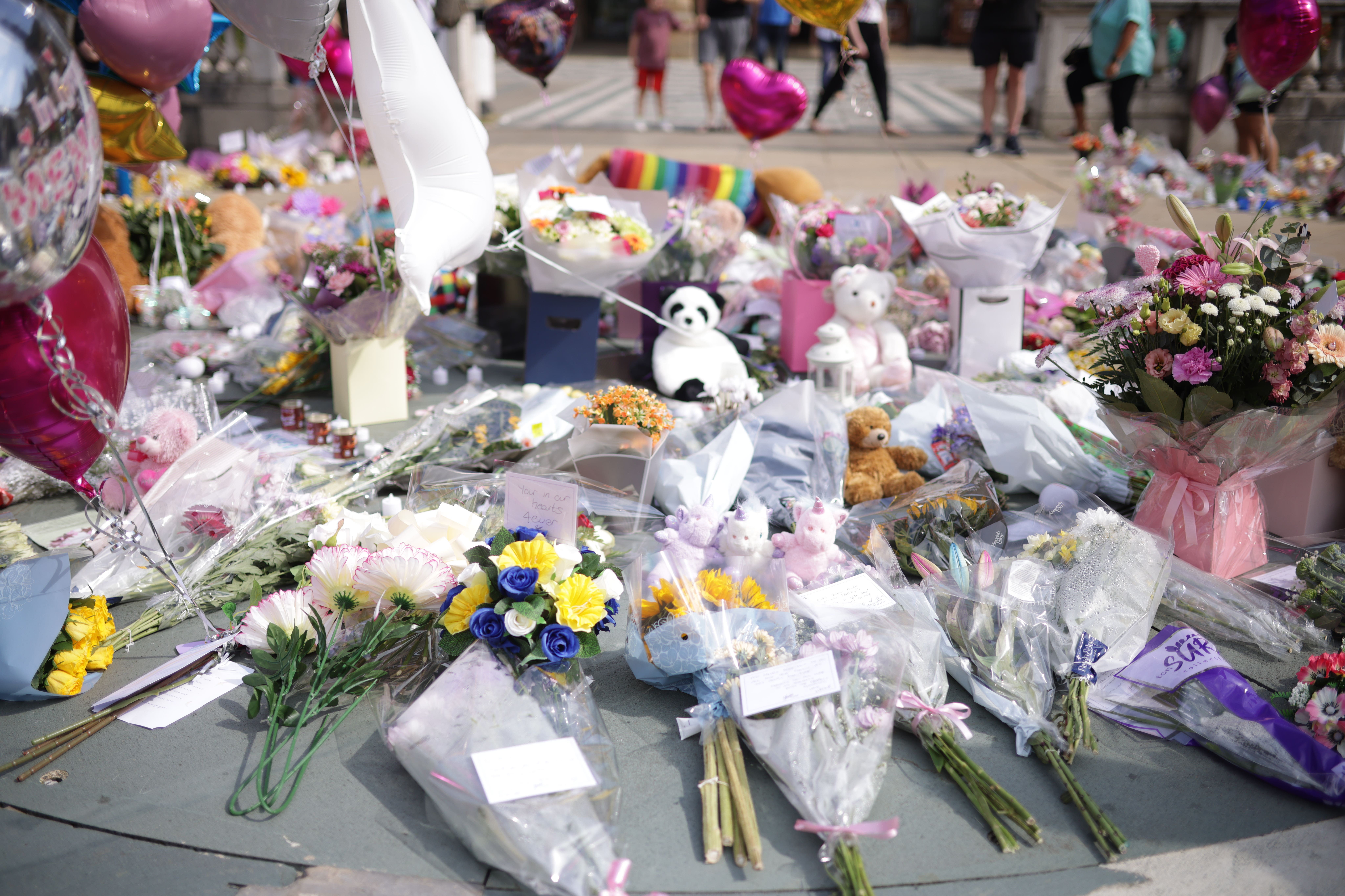 Flowers and tributes outside the Atkinson Art Centre Southport, after three children were fatally stabbed at a Taylor Swift-themed holiday club (James Speakman/PA)