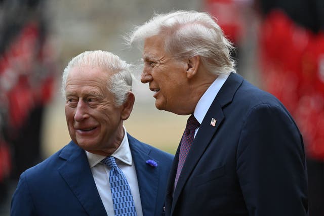 King Charles and US President Donald Trump review the guard of honour during the ceremonial welcome at Windsor Castle (Eddie Mulholland/Daily Telegraph/PA)