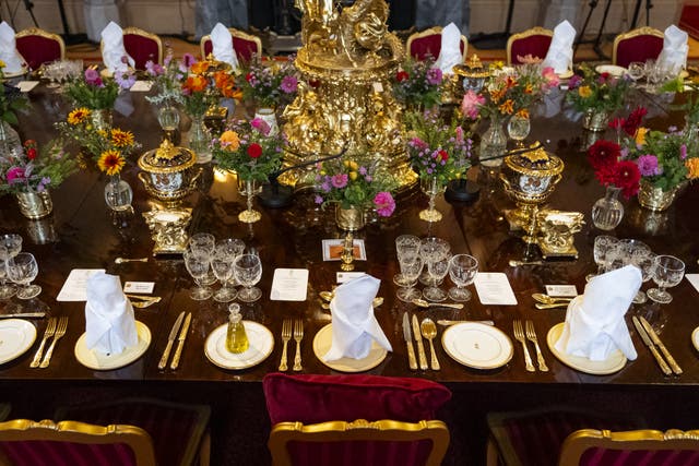 <p>The banquet table in St George’s Hall, Windsor Castle, ahead of the state banquet for US President Donald Trump (Aaron Chown/PA)</p>